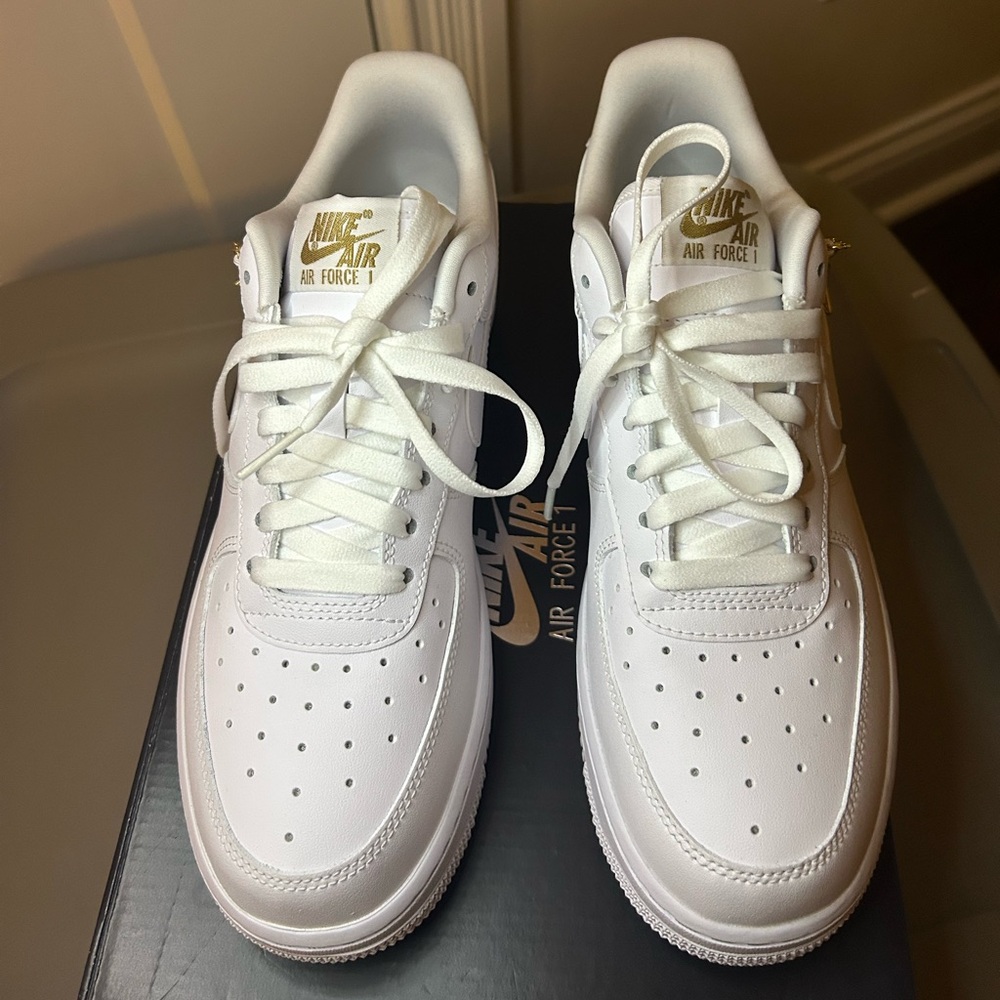 Nike Air Force 1 White and Gold Sneakers